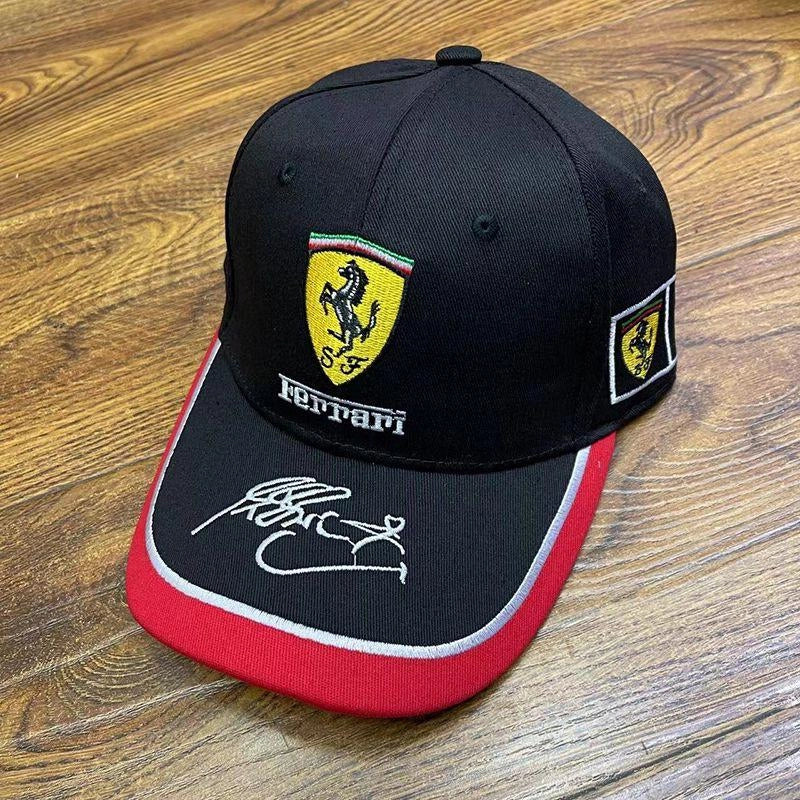 Detail of the embroidered Ferrari shield on the black F1 cap