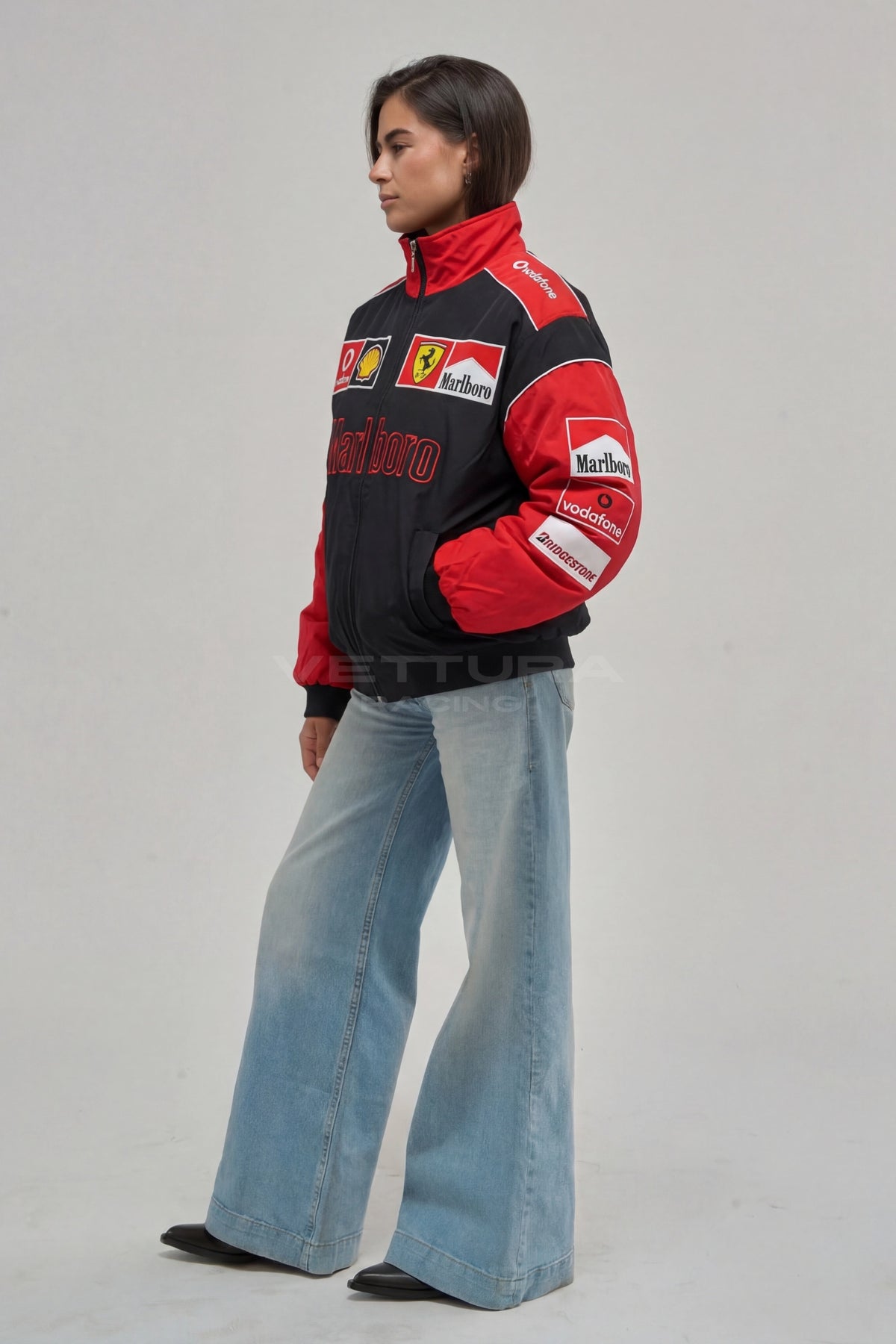 Model wearing the Ferrari F1 Marlboro racing jacket in red and black, front view