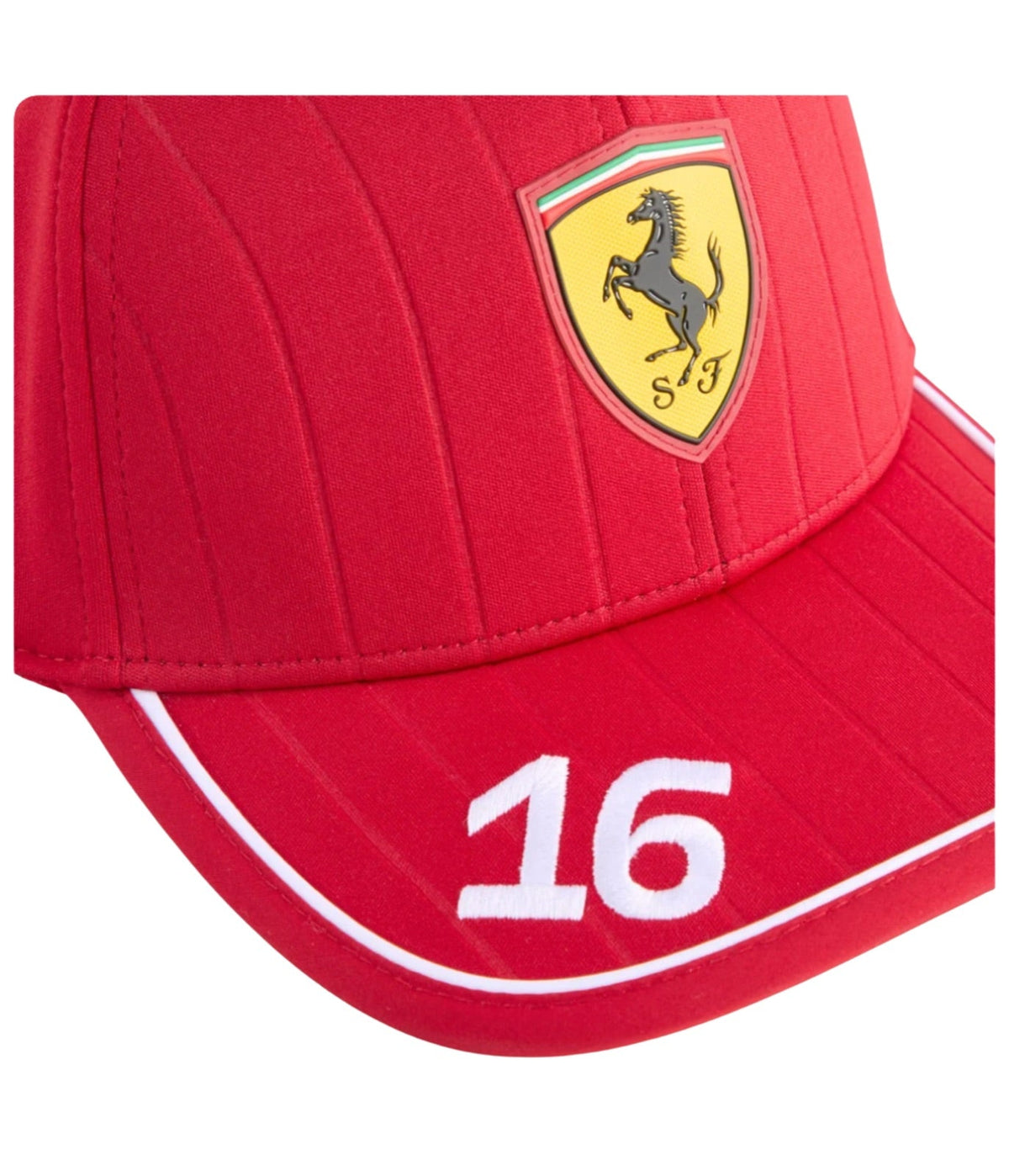 Close-up of the raised Prancing Horse shield and stitched number 16 on the red Ferrari cap