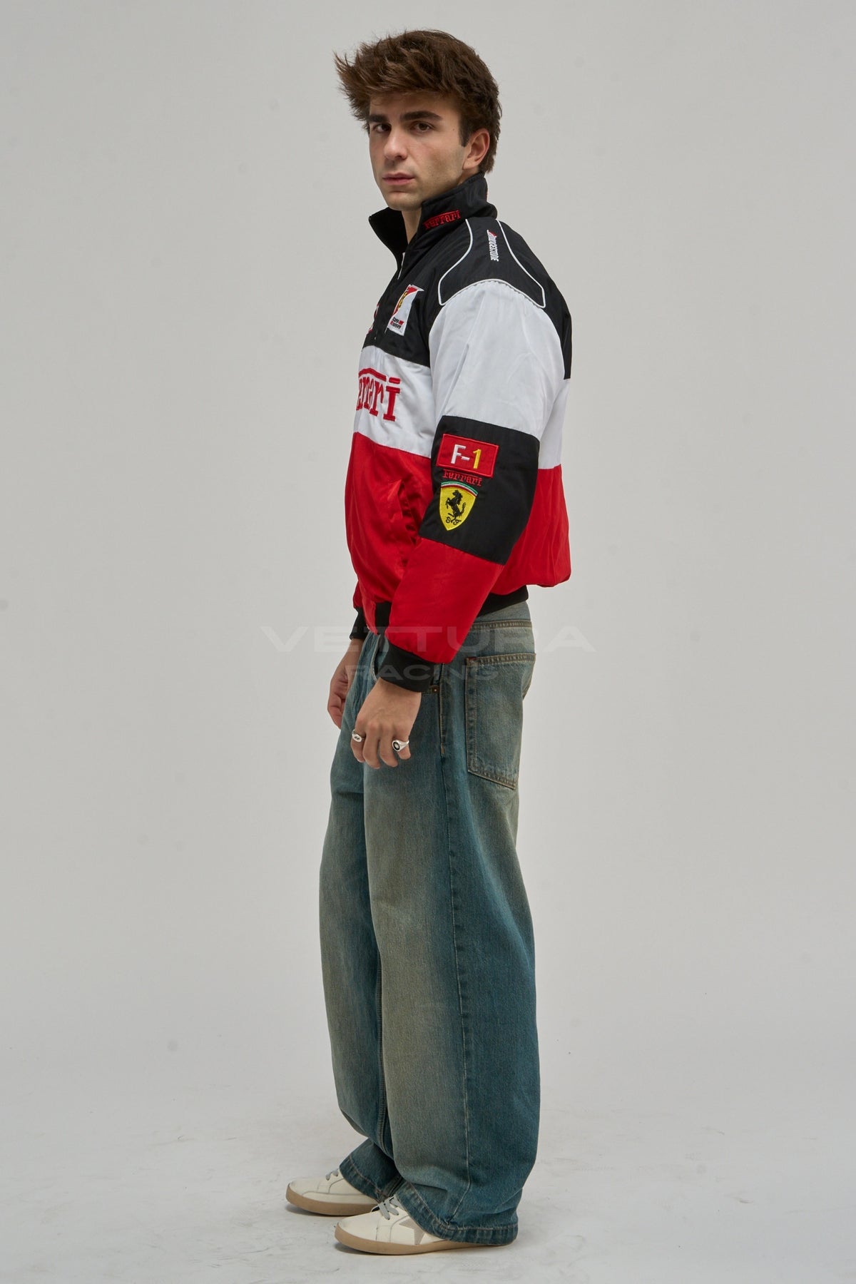 Model wearing the Ferrari F1 classic racing bomber jacket, front view with the red Ferrari block