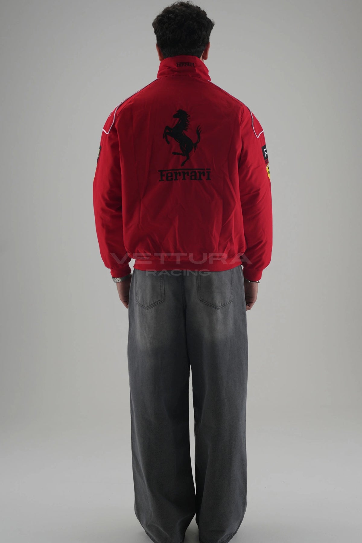 Back of the red Ferrari F1 vintage racing jacket showing the embroidered Prancing Horse
