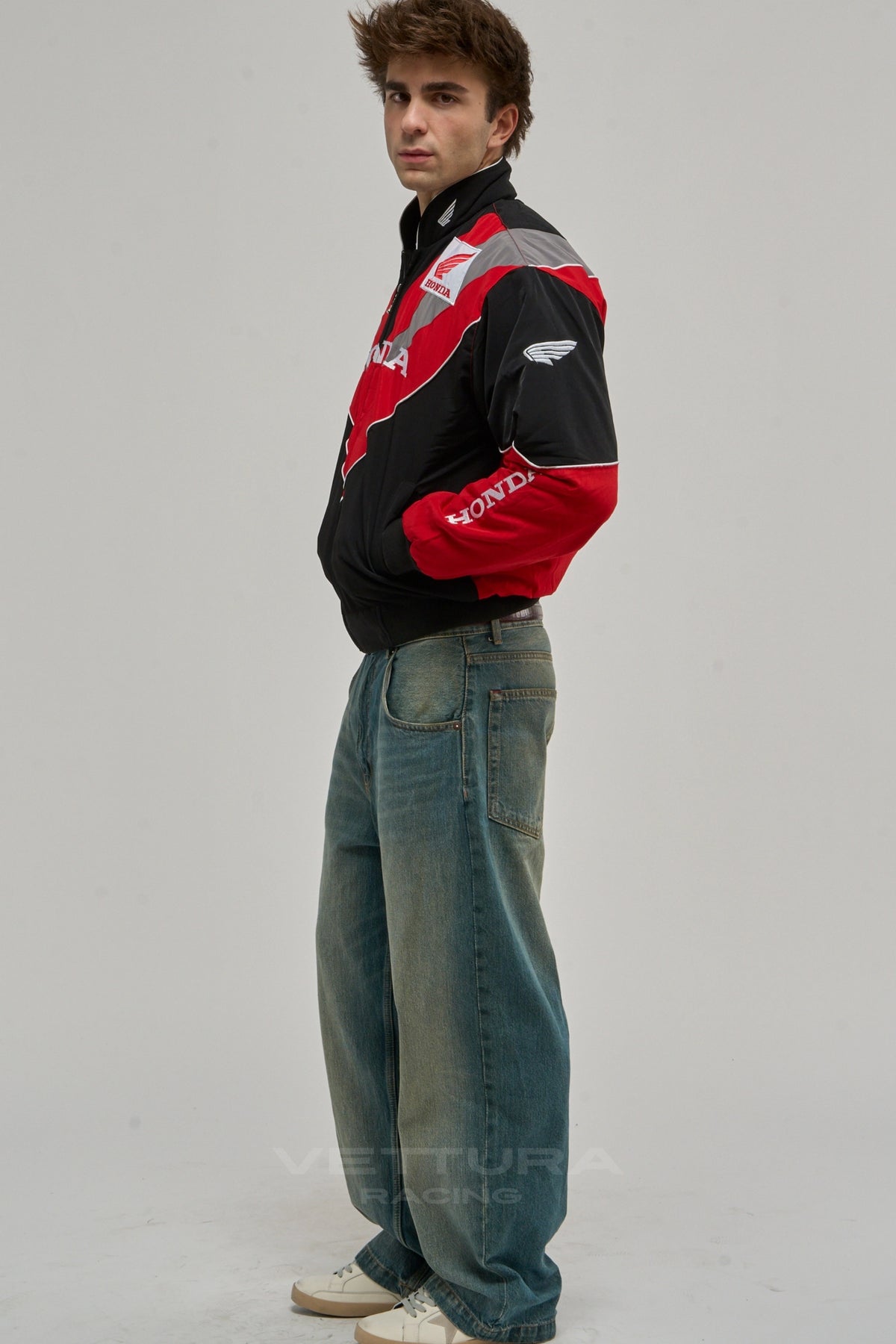 Back of the Honda racing jacket with the winged crest, worn on a model