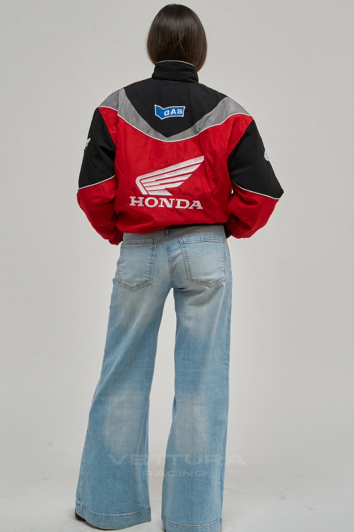 Model wearing the Honda vintage racing jacket in red and black, front view