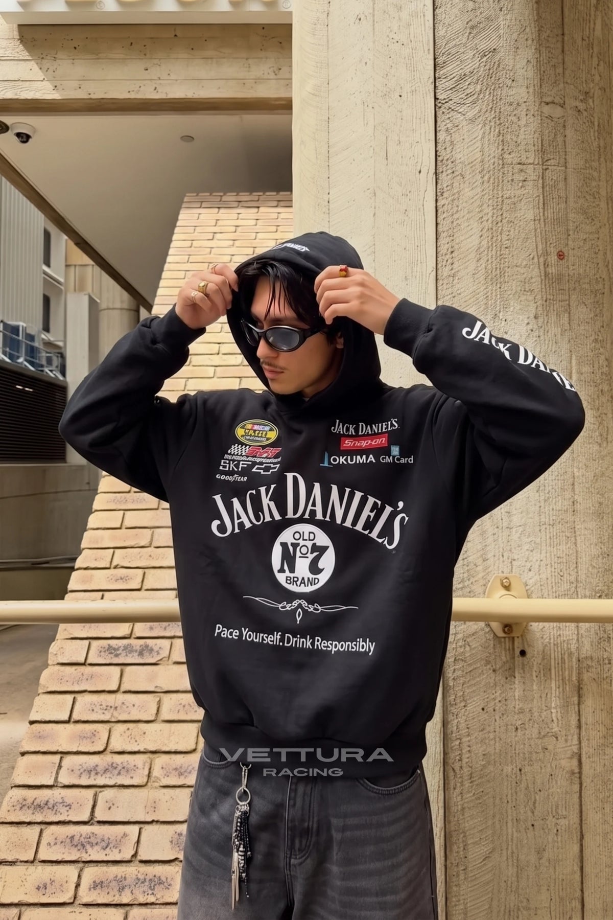 Jack Daniel’s embroidered hoodie worn with the hood up outdoors