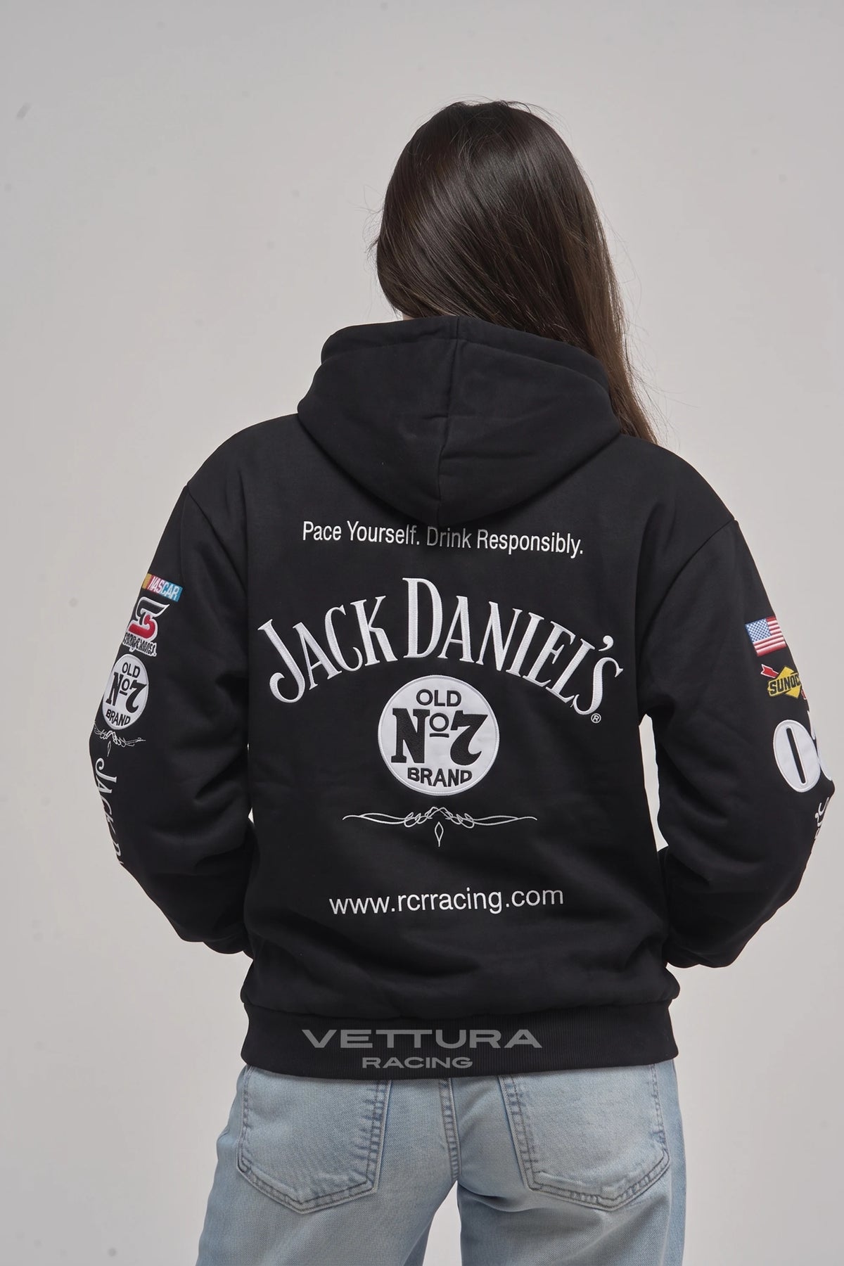 Woman wearing the Jack Daniel’s hoodie, back view with the stitched Old No.7 label
