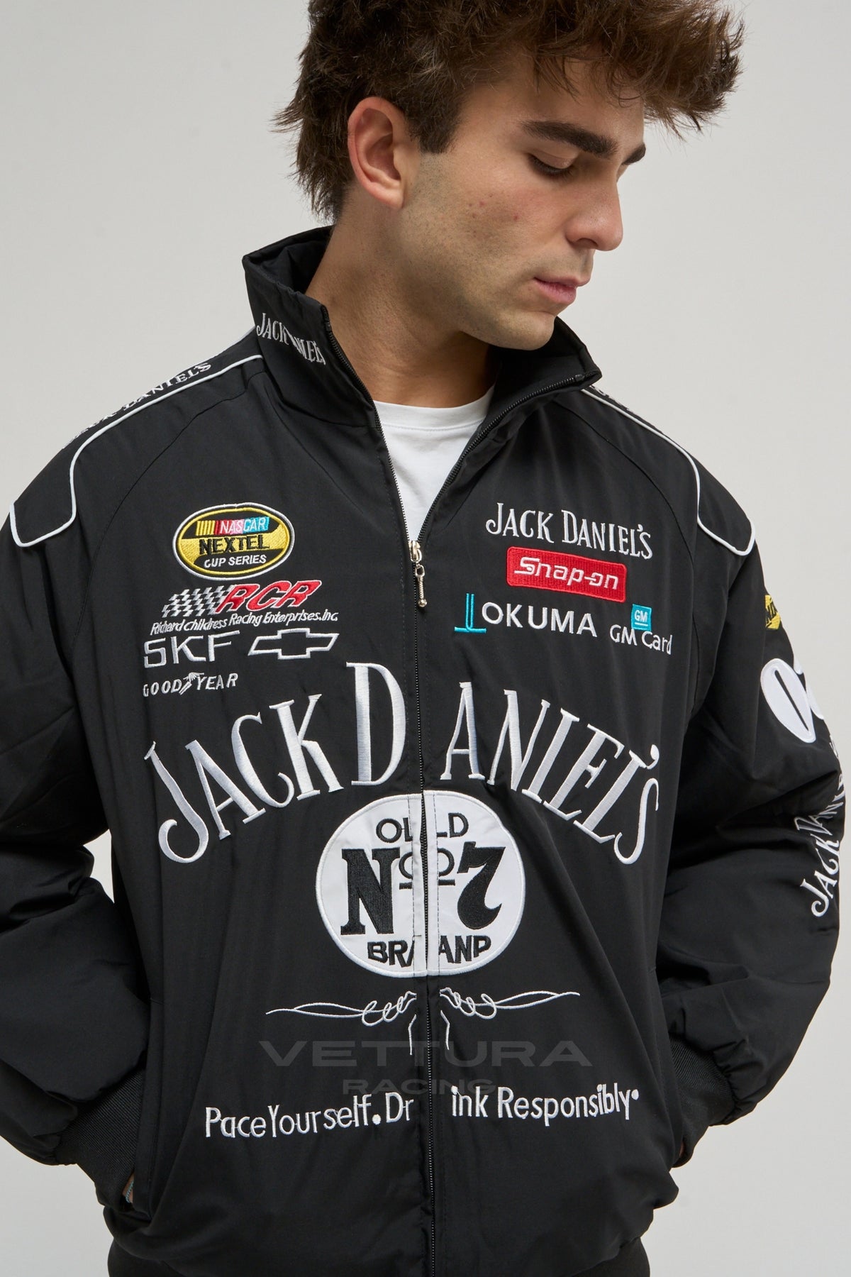 Model wearing the black Jack Daniel's racing vintage jacket, front view
