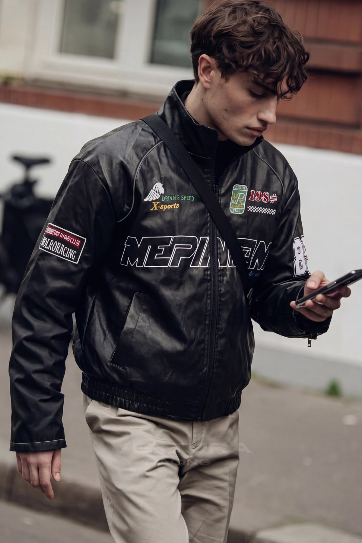 Close view of the chest wordmark on the LAP 85 black jacket