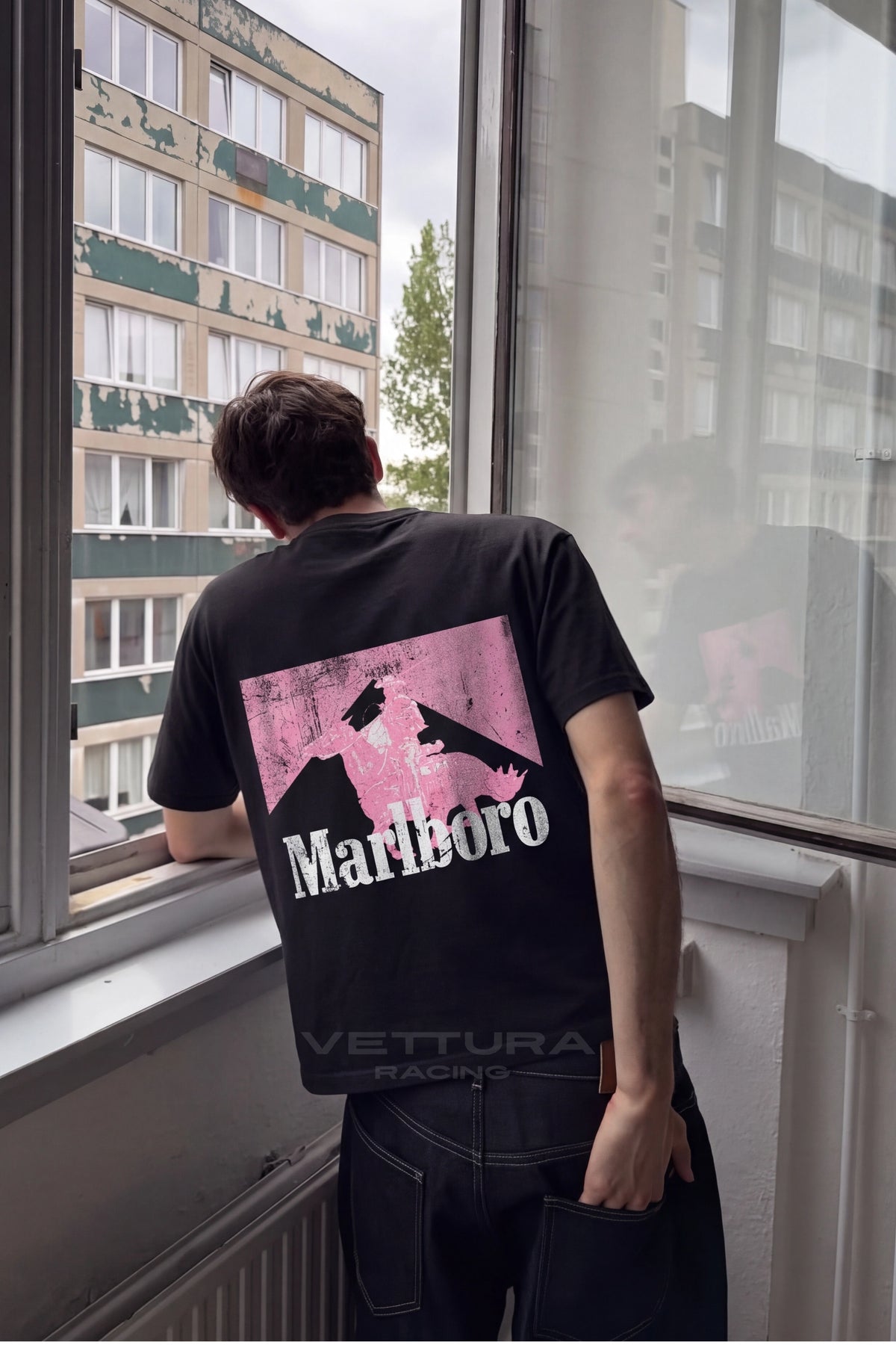 Marlboro racing t-shirt in black and pink styled in daylight