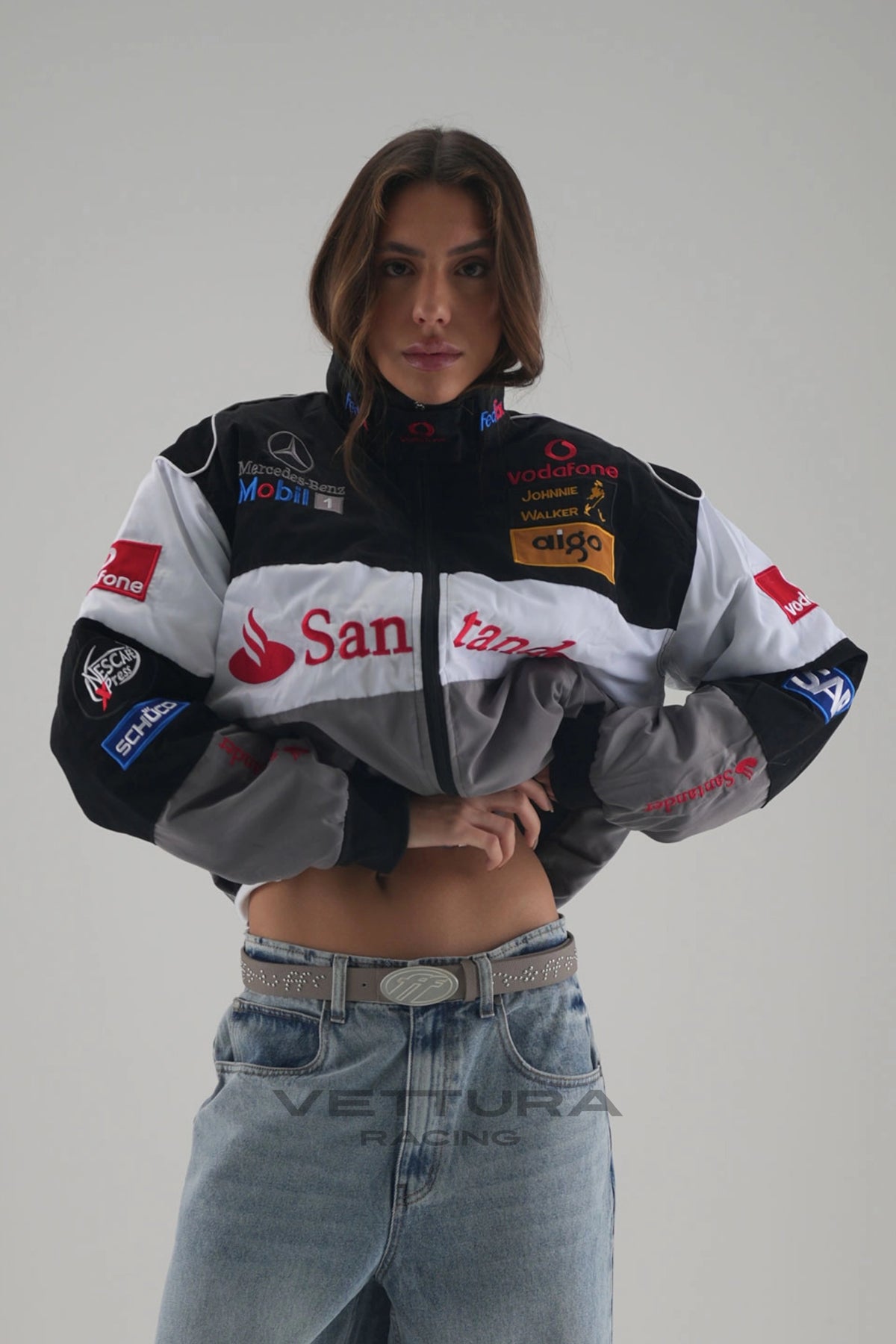 Woman wearing the McLaren Mercedes vintage F1 racing jacket with embroidered sponsor patches