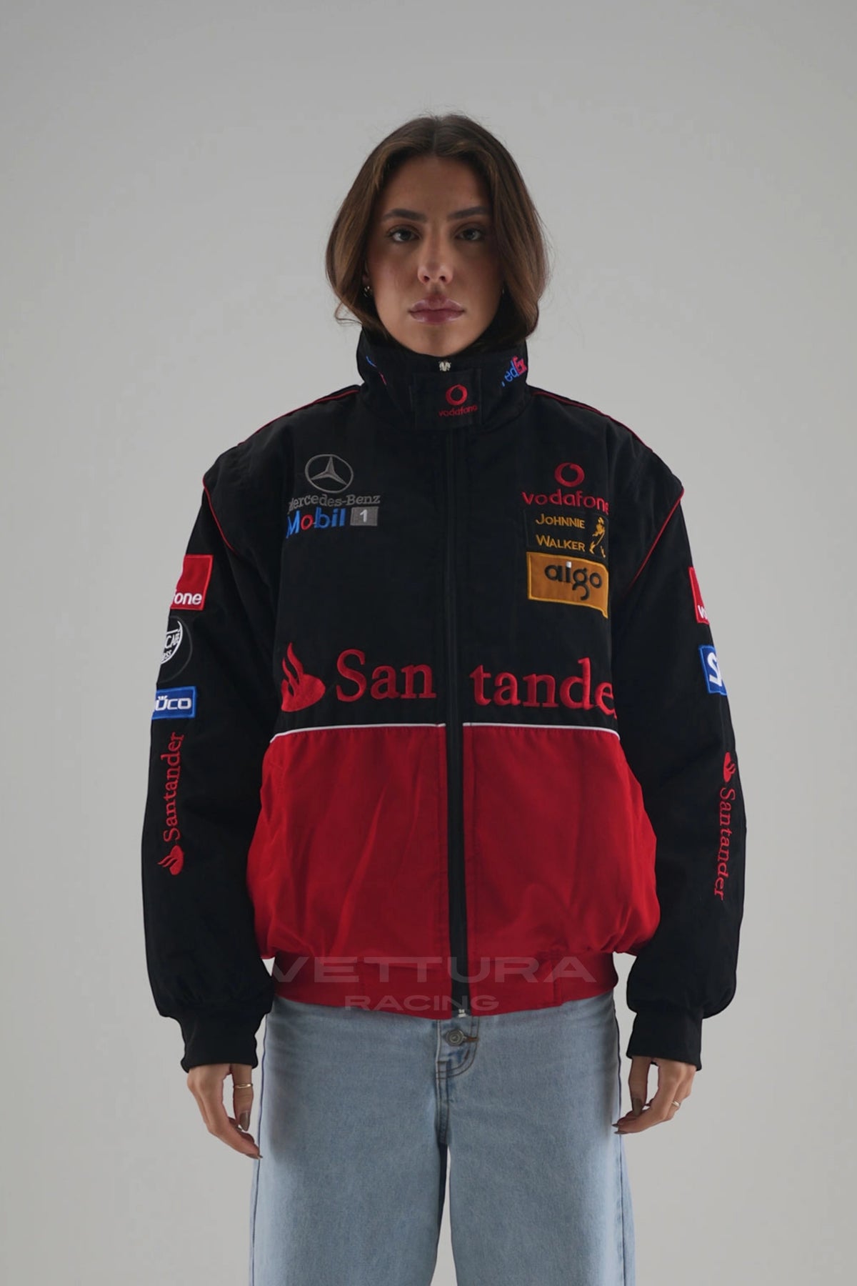 Woman wearing the black and red McLaren Mercedes vintage F1 jacket