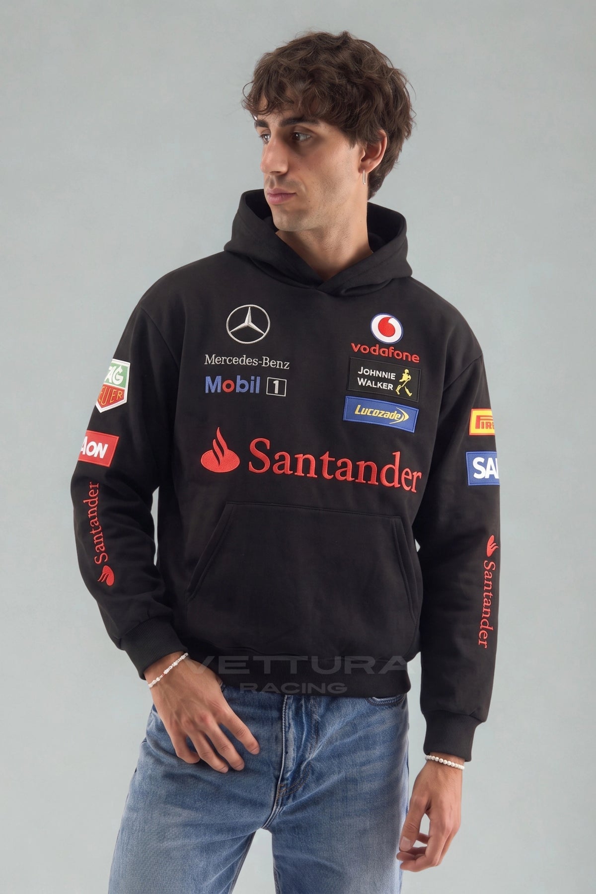 Model wearing the Mercedes-Benz racing embroidered hoodie in black, front view