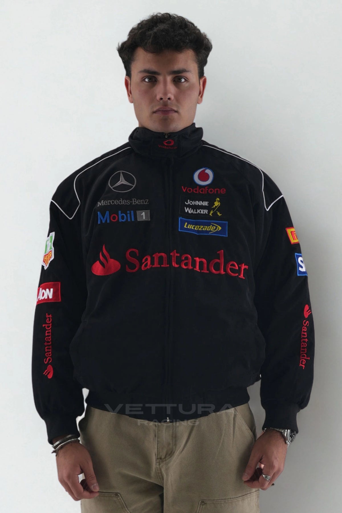 Model wearing the black Mercedes-Benz Santander vintage F1 jacket, front view