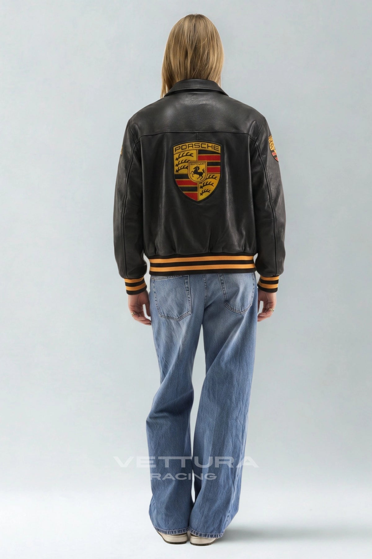 Model wearing the Porsche 993 Turbo black leather jacket, back crest view