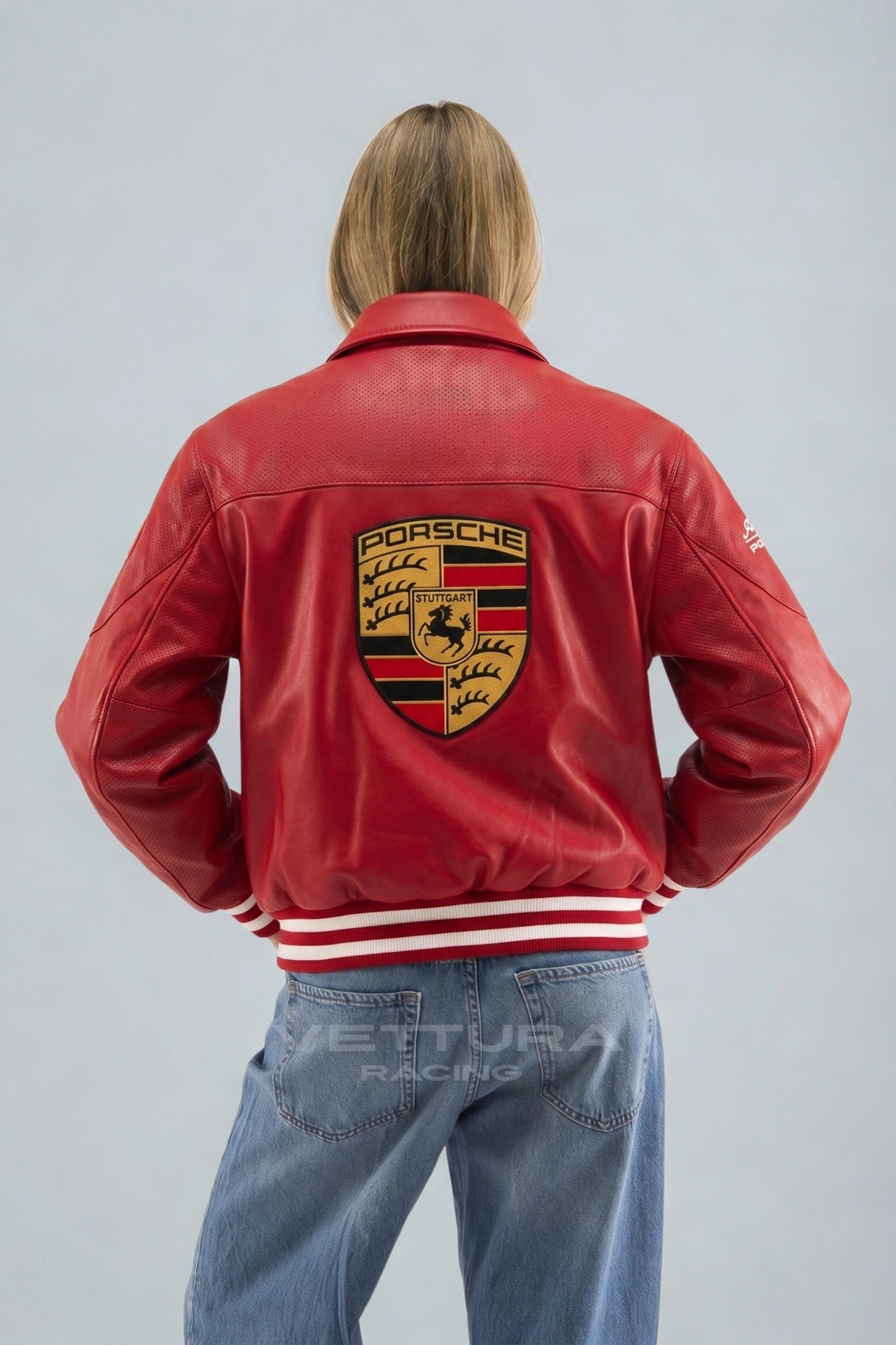 Porsche red leather jacket on a model, showing the crest on the back