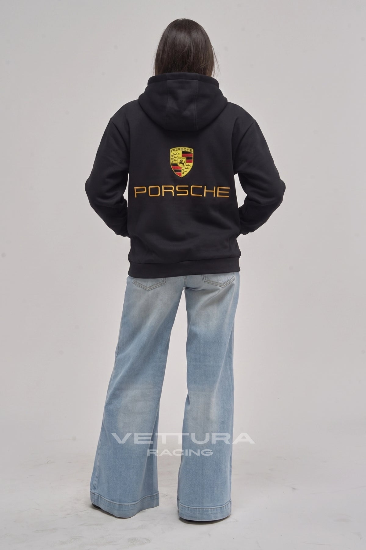 Porsche racing hoodie worn with jeans, relaxed fit