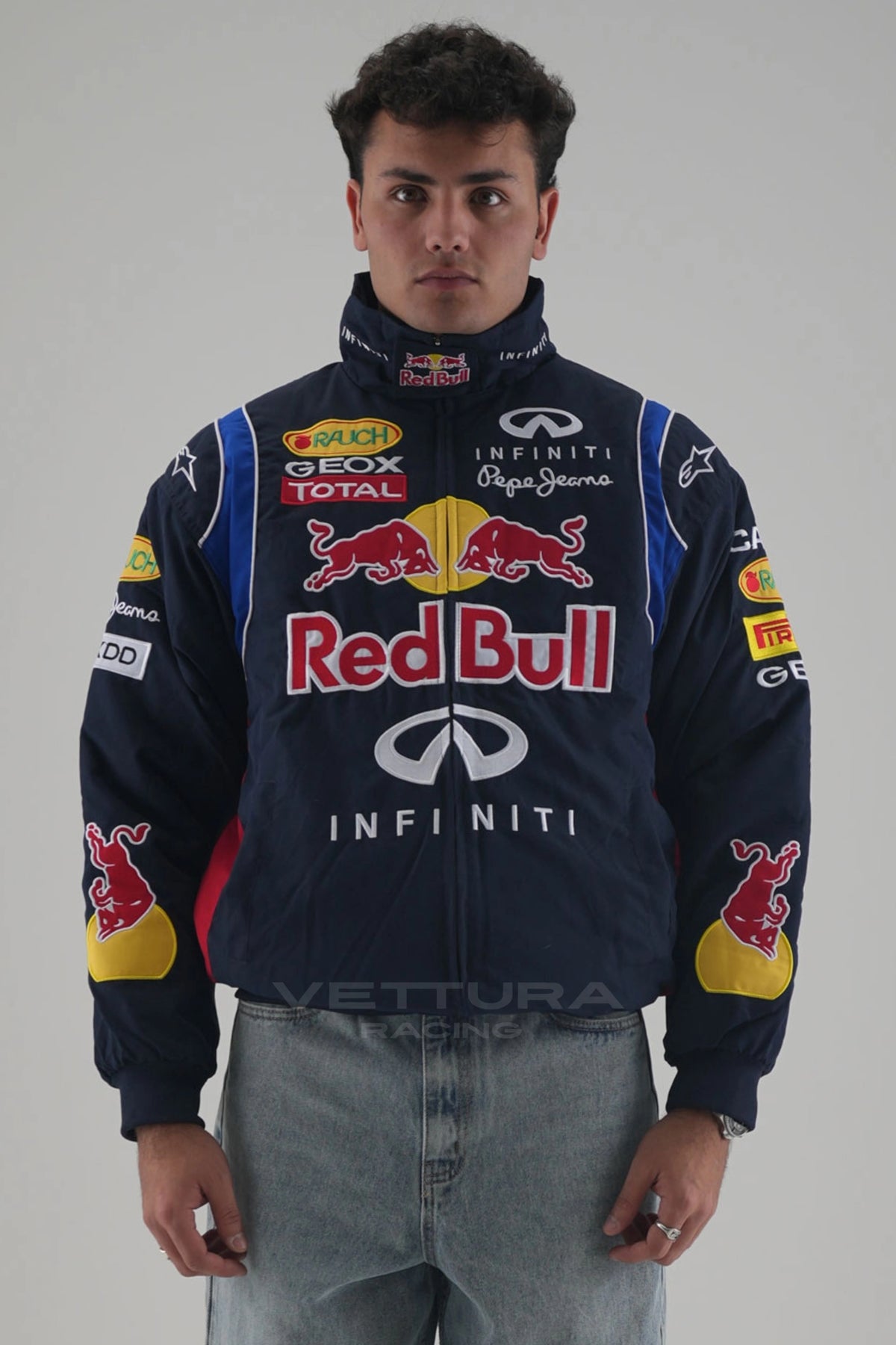 Model wearing the navy Red Bull F1 racing jacket, front view