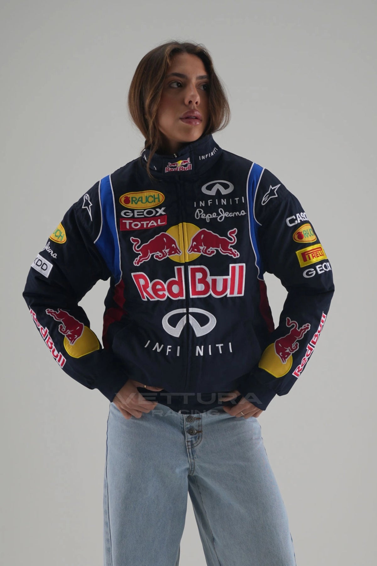 Woman wearing the navy Red Bull F1 racing jacket