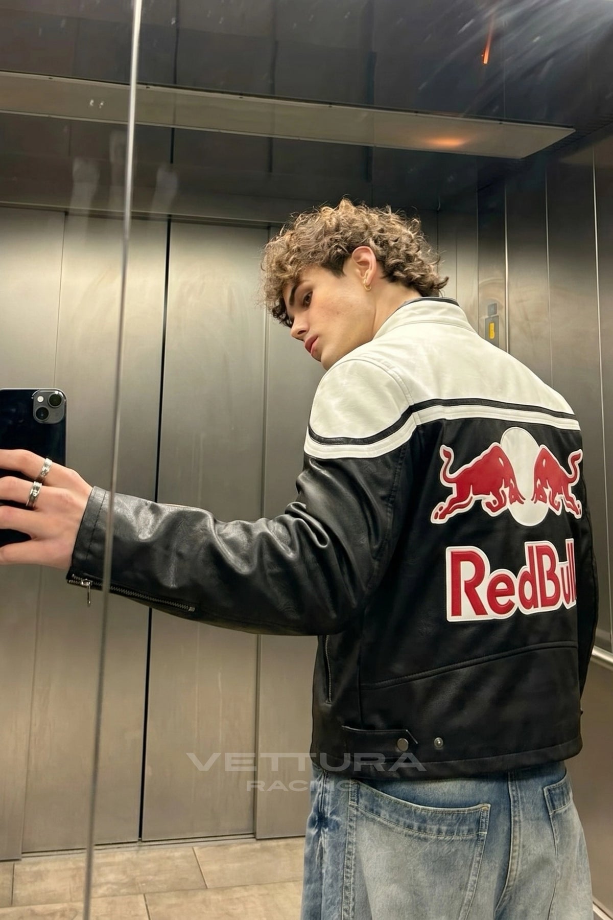 Close view of the stitched Motul and Michelin patches on the Red Bull jacket