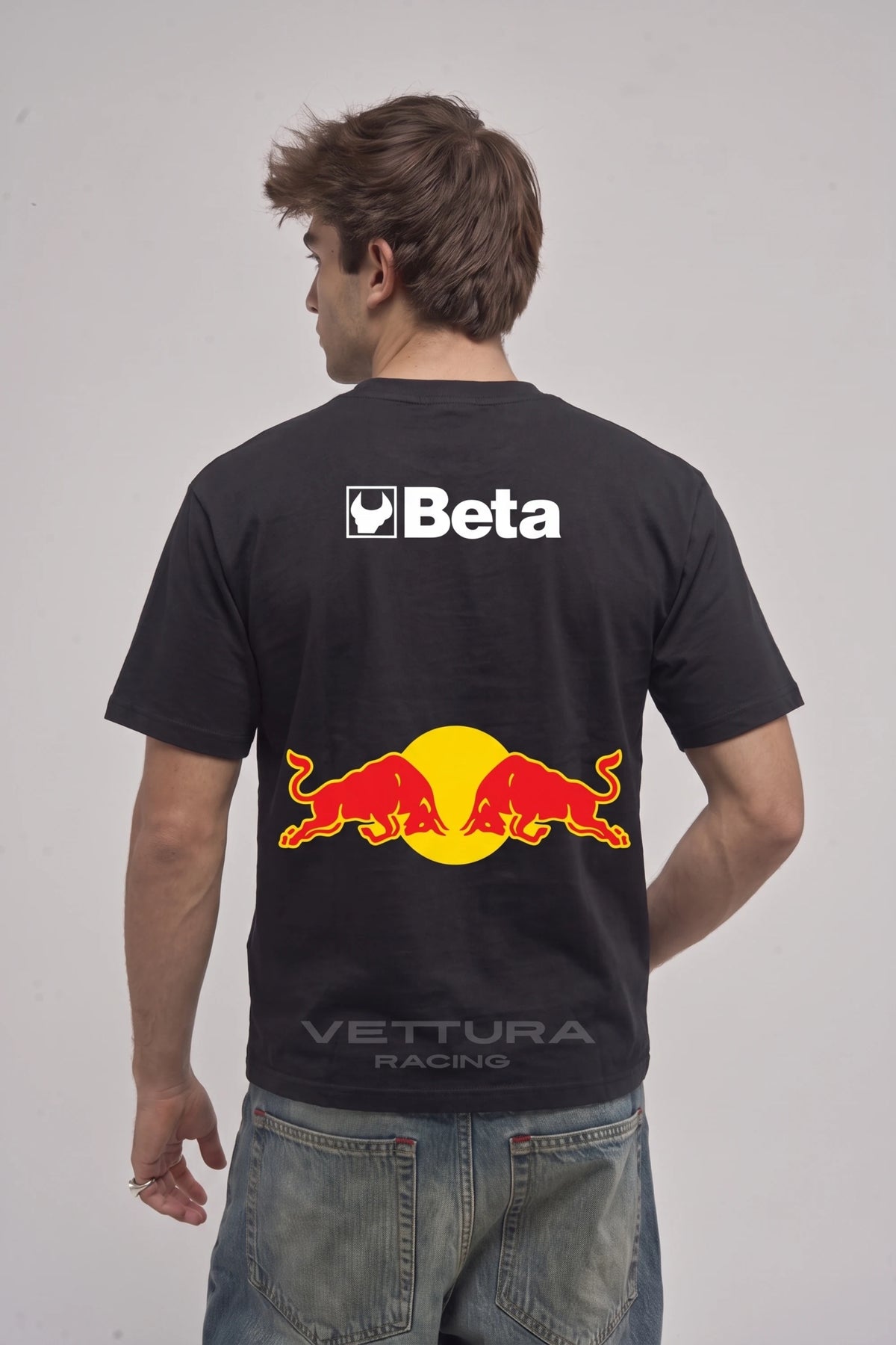 Man wearing the Red Bull classic edition tee, back view with the white Beta panel and charging bulls