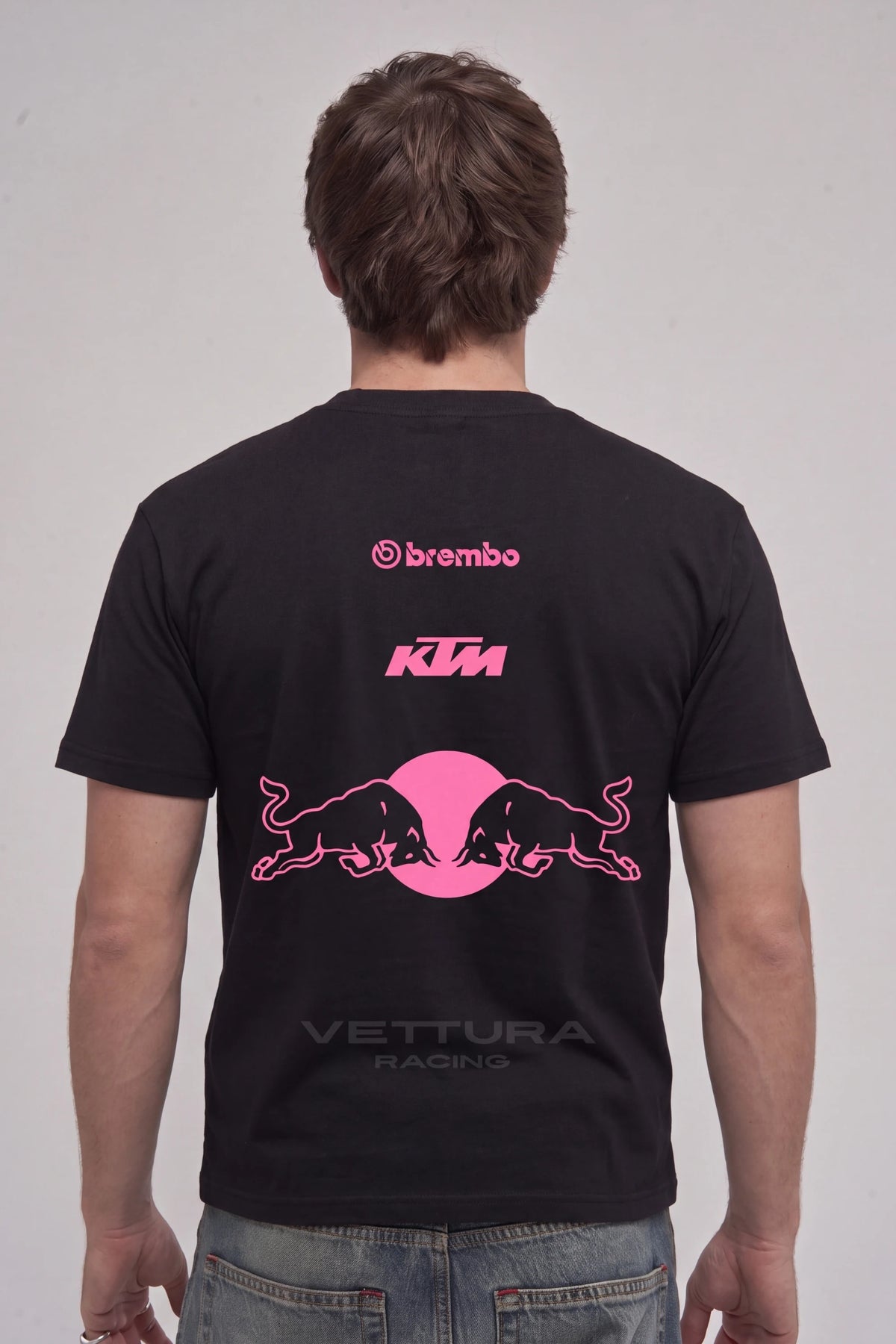 Man wearing the Red Bull pink edition tee, back view with the KTM and Brembo prints