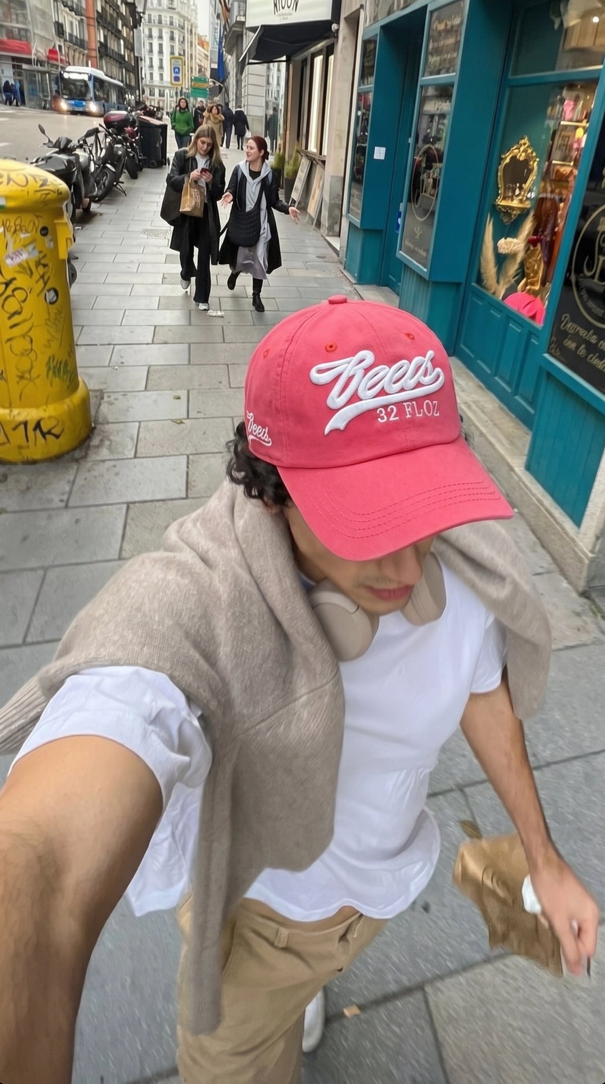 Pink Reese's embroidered cap worn outdoors