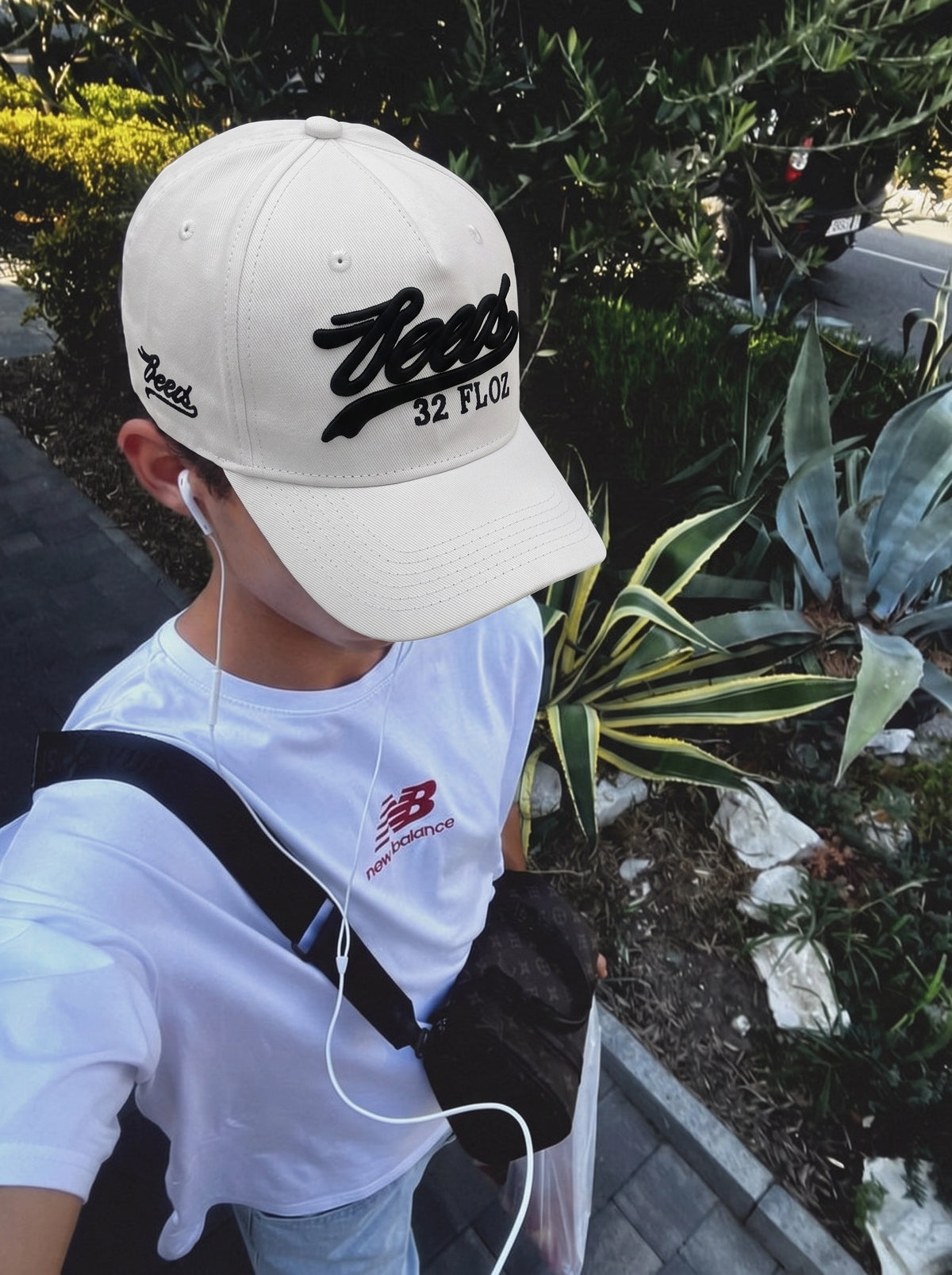 Black Reese's embroidered cap worn with a summer outfit