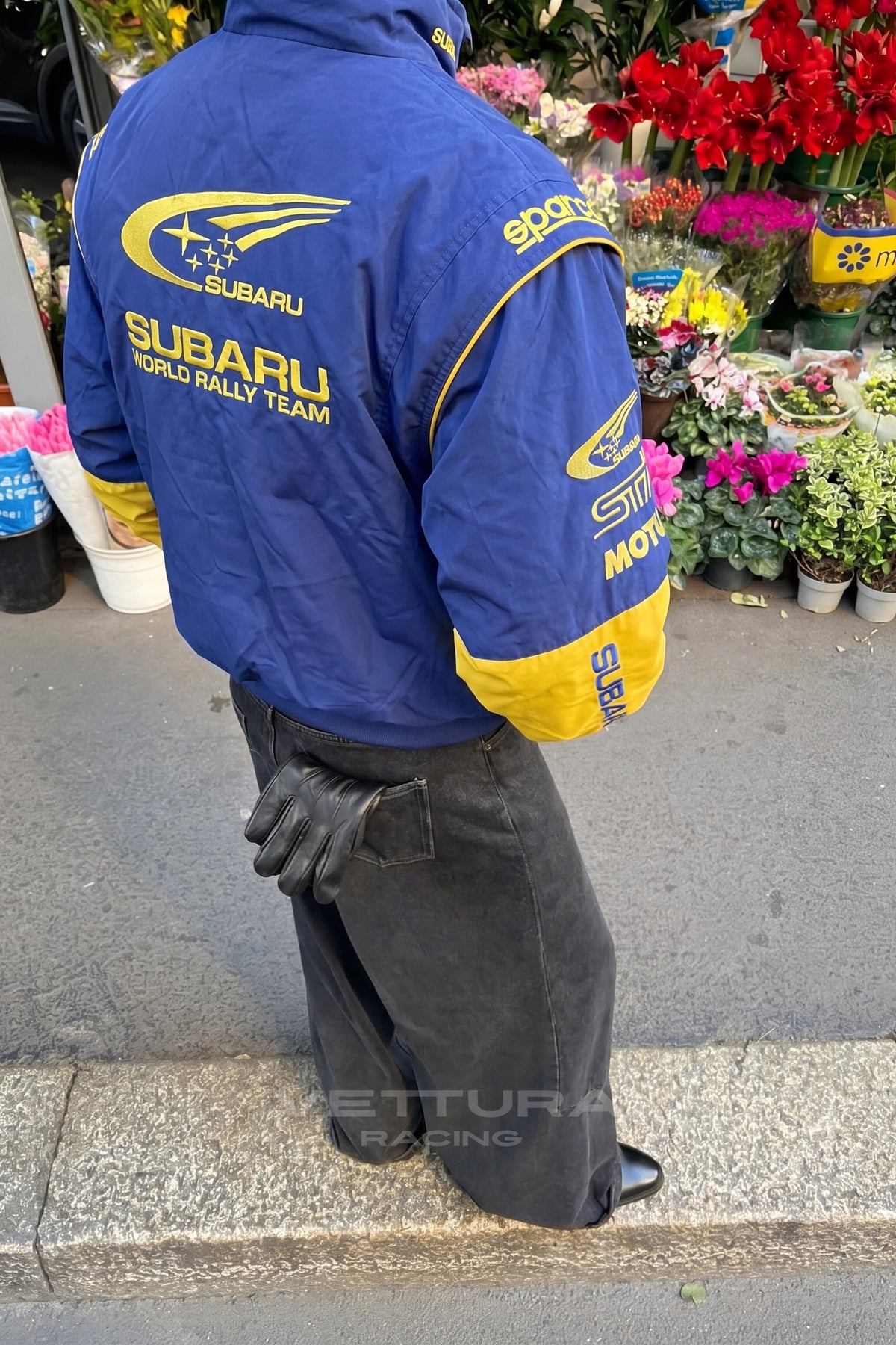 Detail of the embroidered Subaru rally jacket back panel outdoors