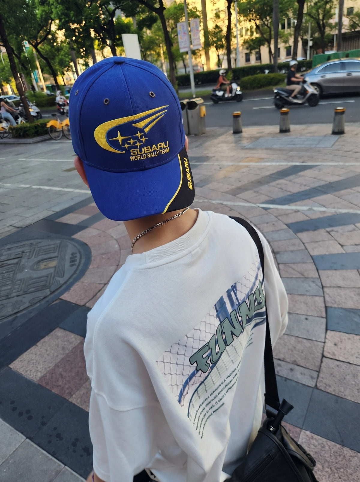Subaru rally cap worn on the street