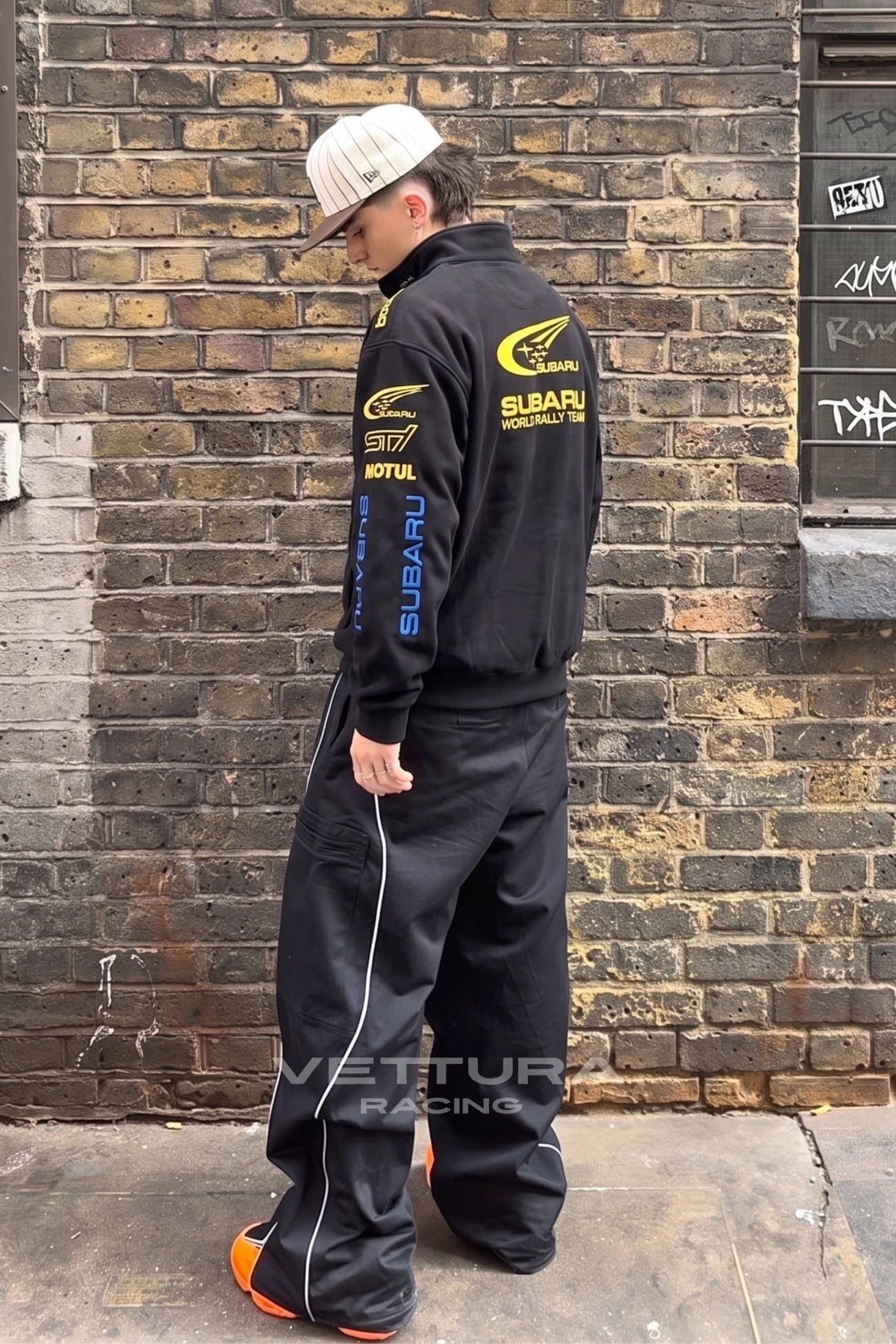Detail of the full zip and ribbed cuffs on the Subaru rally sweatshirt