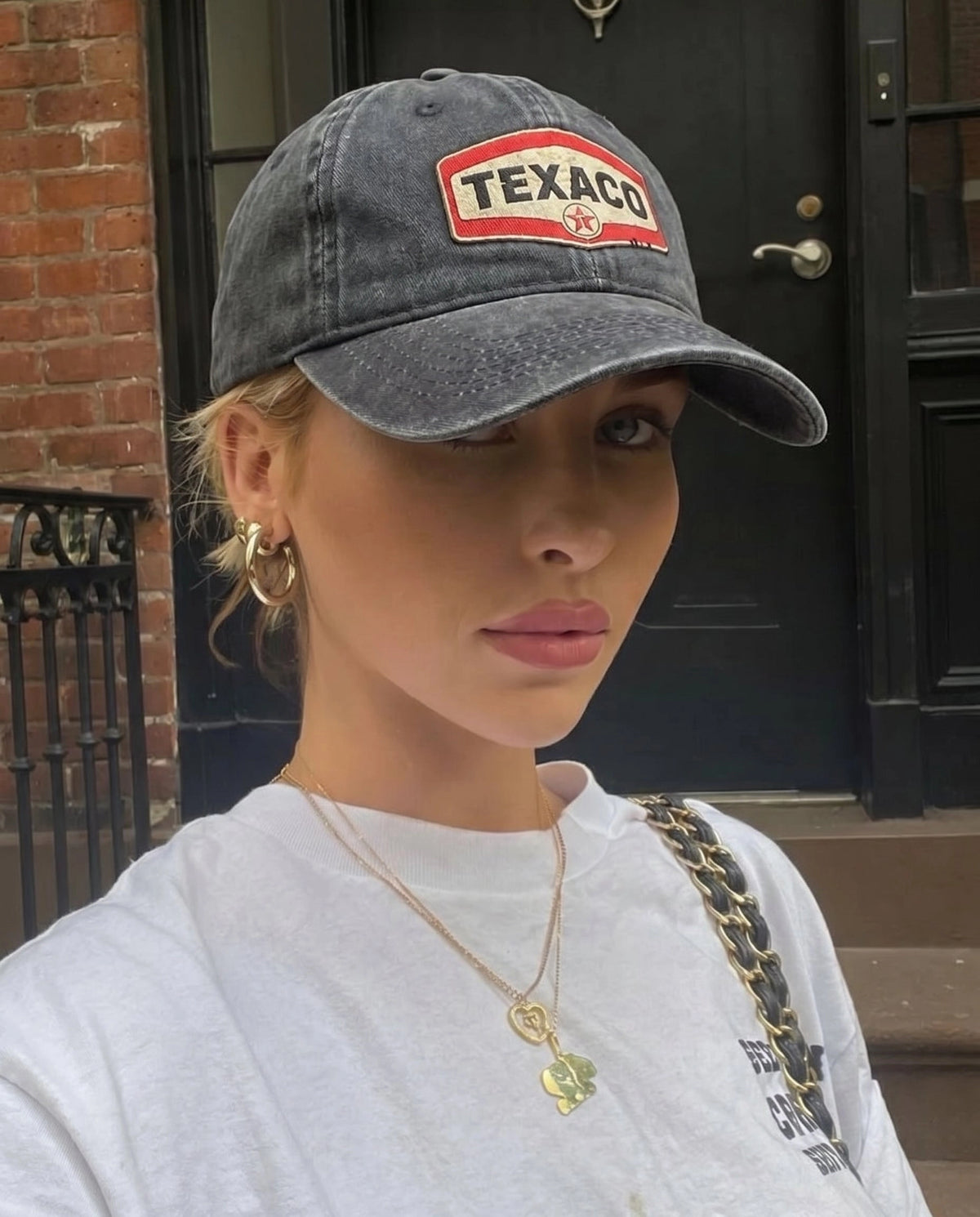 Texaco Motor cap worn with a black outfit