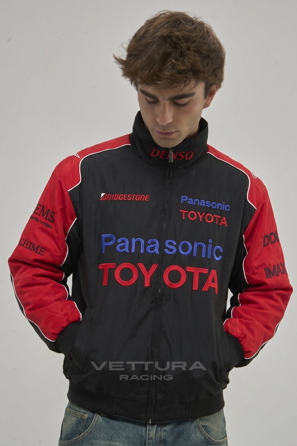 Toyota black racing jacket styled with jeans in daylight