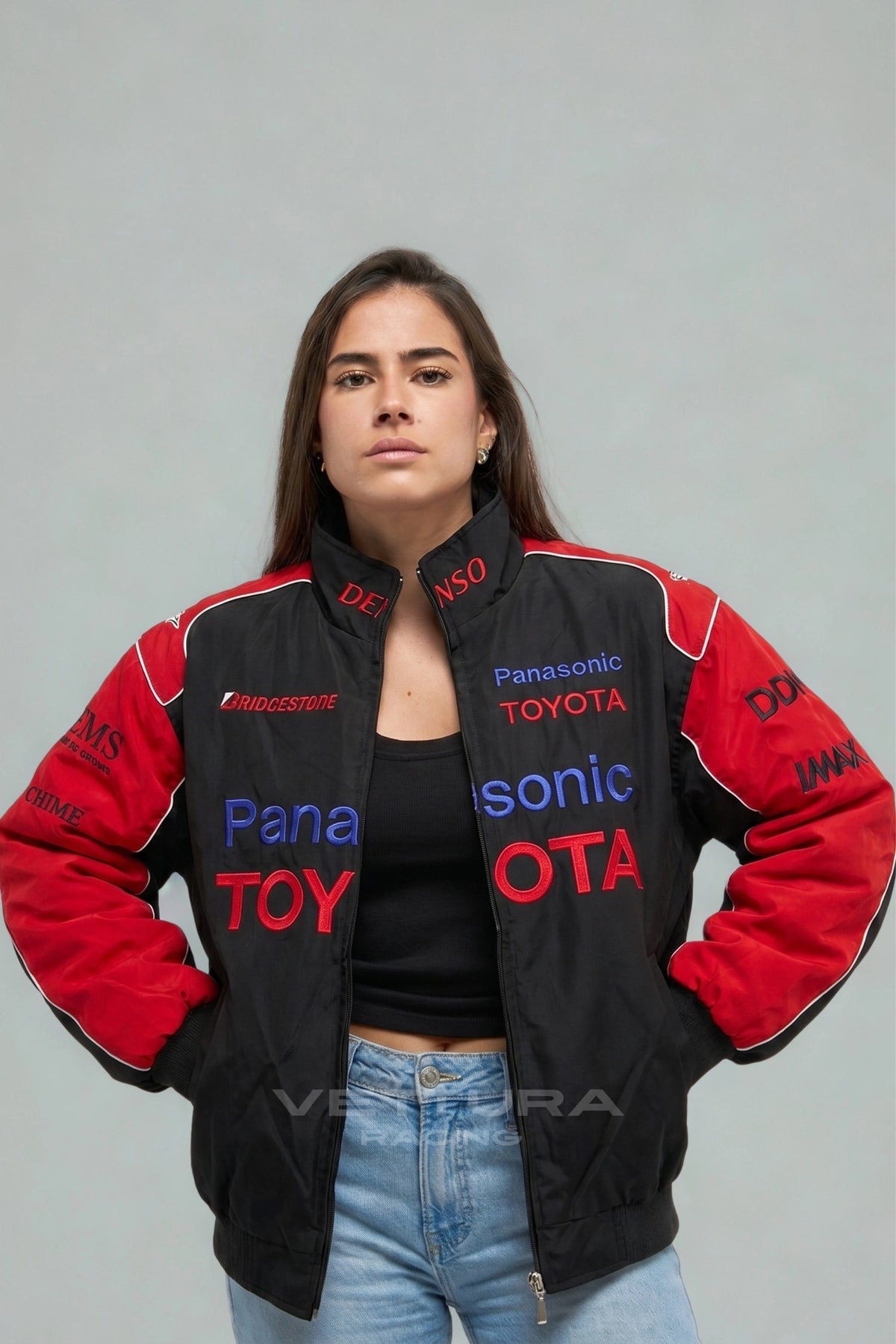 Close view of the Denso and Bridgestone patches on the black Toyota jacket