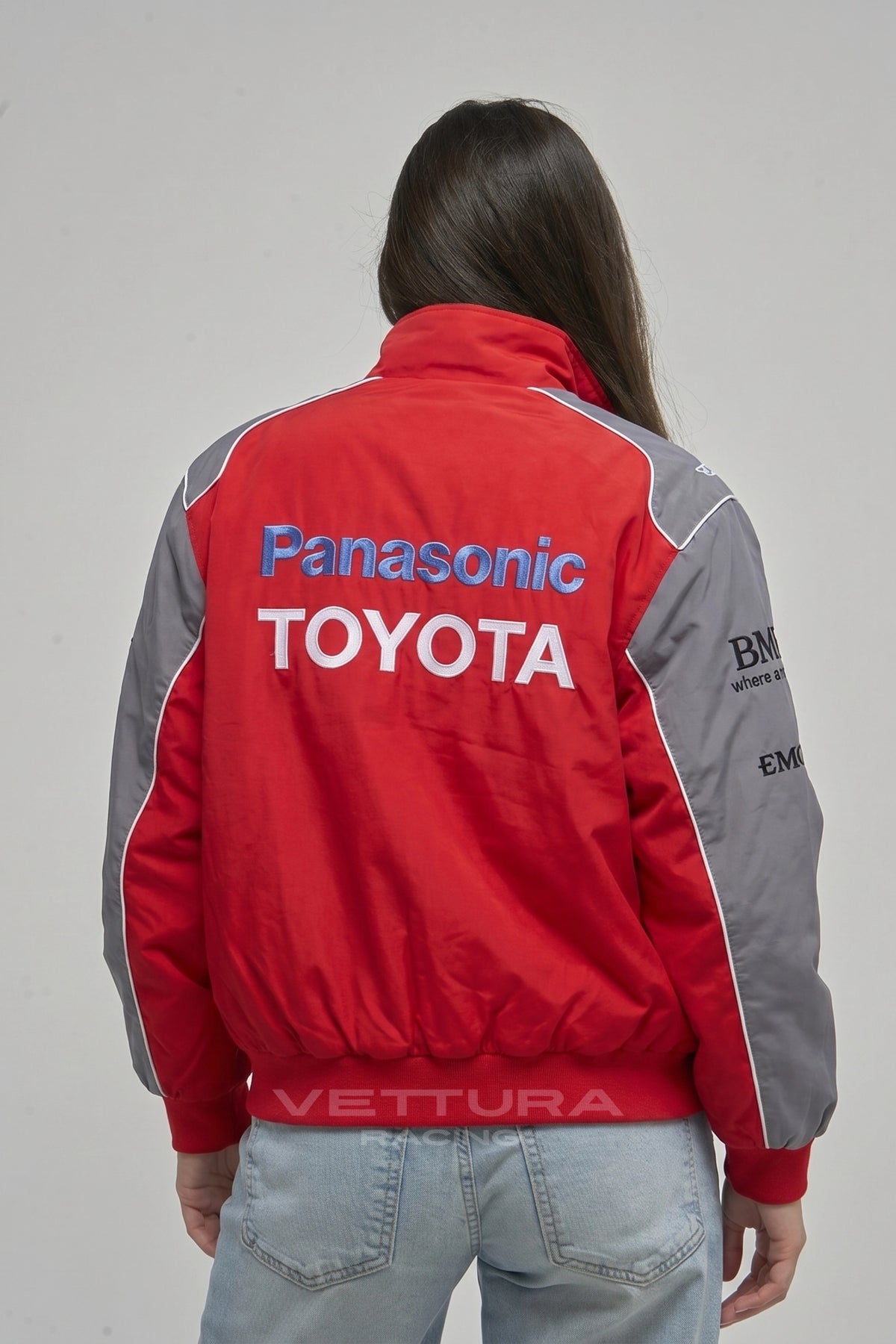 Model wearing the Toyota Panasonic red vintage racing jacket, front view