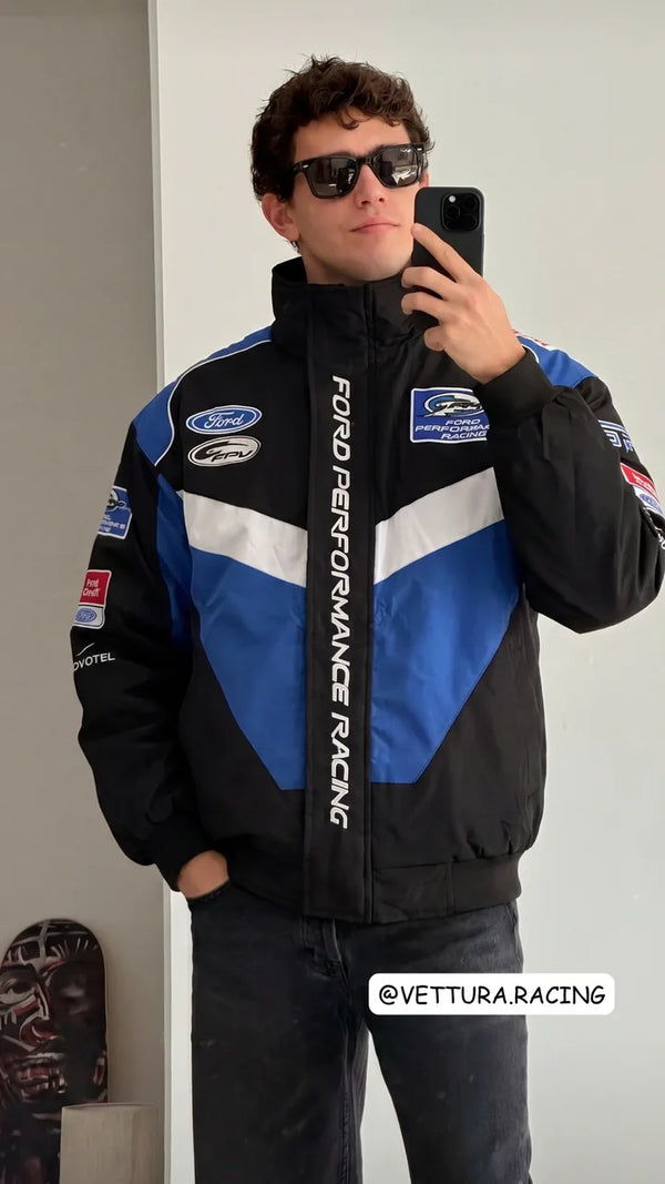 Customer in a black and blue Ford Performance Racing jacket