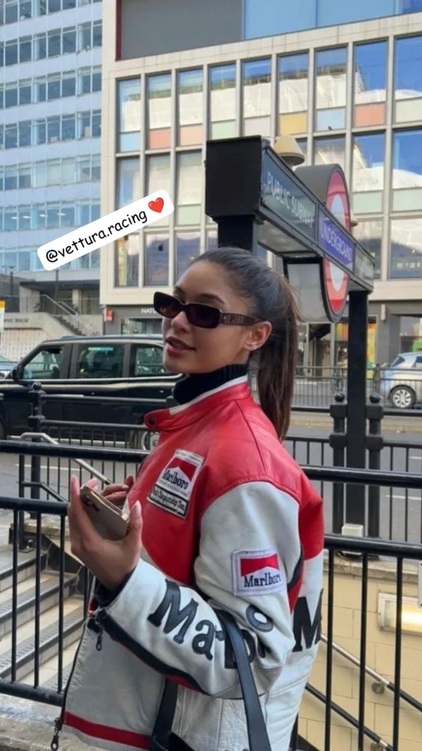Customer wearing a red and white Marlboro leather racing jacket in the city