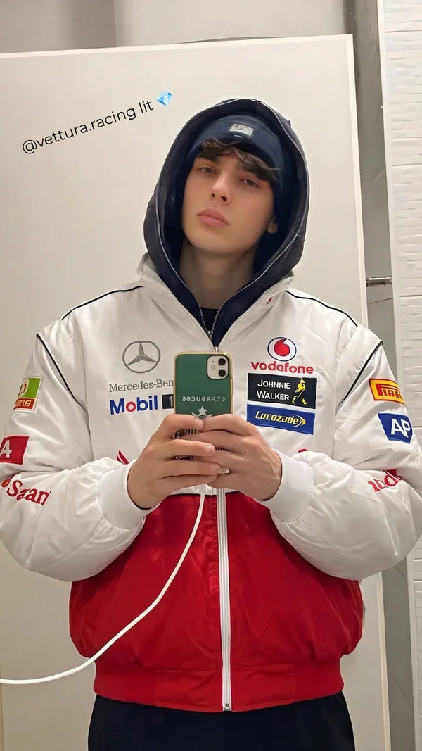 Customer mirror selfie in a white Mercedes McLaren racing jacket