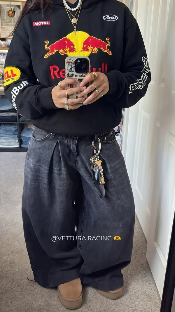 Customer mirror selfie in a black Red Bull racing jacket
