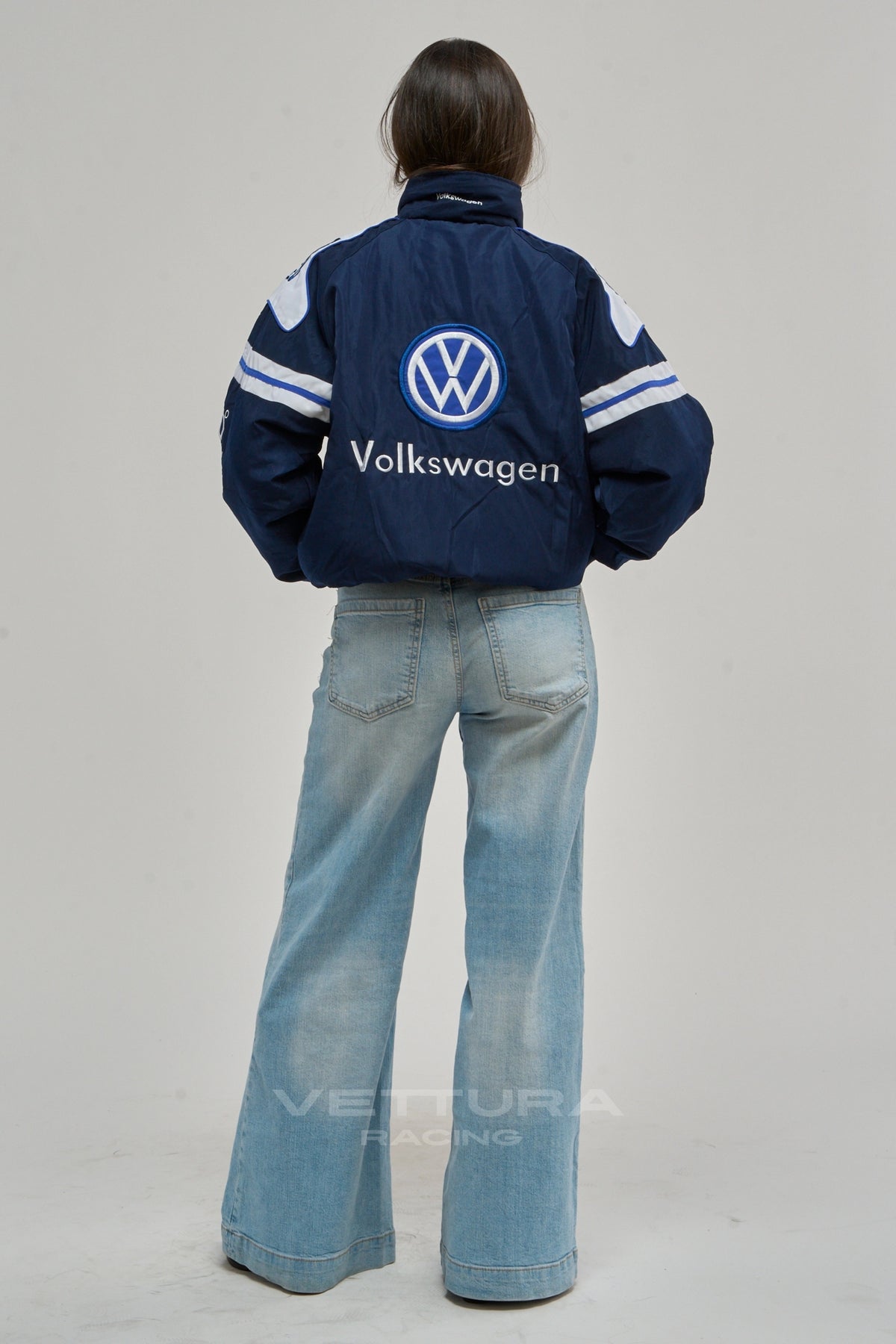 Volkswagen racing jacket on a model, chevron stripe detail
